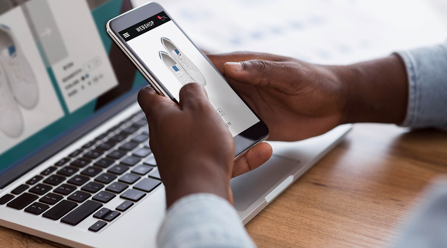 Top Web Design Trends for Small Businesses in 2024: How to Create a Website That Converts 1 black man shopping online with smartphone and lapt 2023 11 27 05 26 32 utc